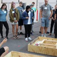 Students watch a robot demonstration